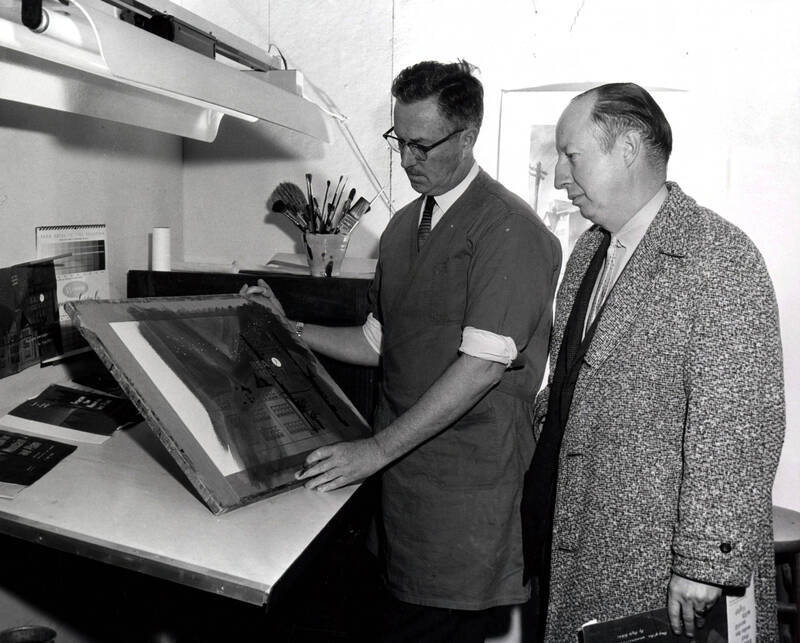 Alf Dunn showing Rafe Gibbs the dust jacket design for "Beacon for Mountain and Plain."