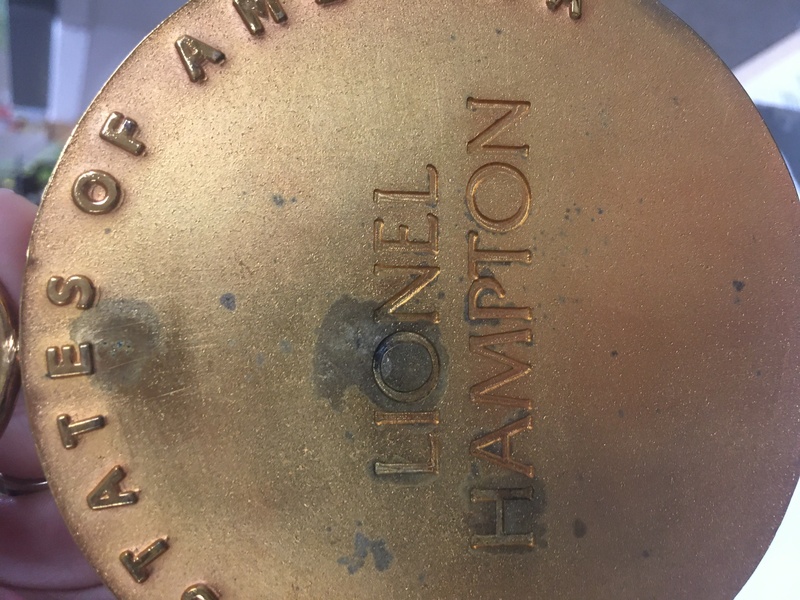 Discoloration of National Medal of Arts-back