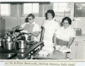 Three women packing meals [2]