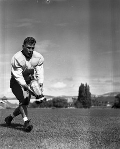 Photo of a football player [C]arrying a handsome potato