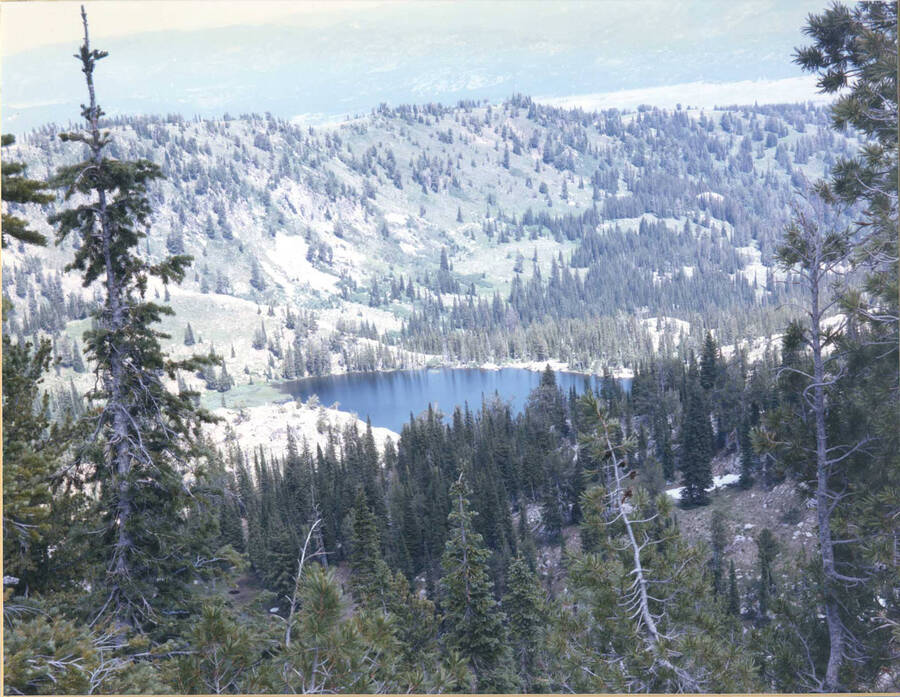 Receiving a score of 23 by the Boise Camera Club, this image shows an idyllic lake surrounded by hills and trees.
