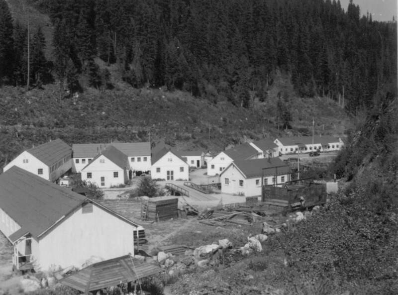 Photograph of the buildings at the Kooskia Internment Camp. The photograph is a part of a scrapbook created by a former guard of the camp.