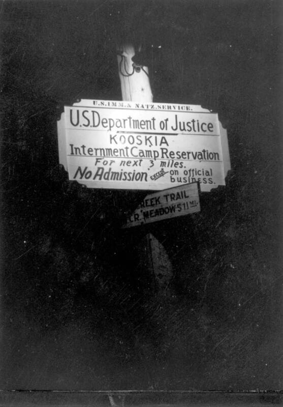 Photograph of the sign at the entrance to the Kooskia Internment Camp. The photograph is a part of a scrapbook created by a former guard of the camp.