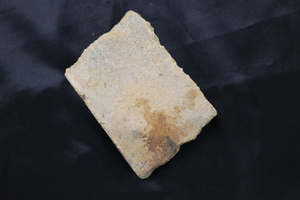 Roof tile torn from the roof of a building due to the force of the atomic bomb landing in Hiroshima, Japan.