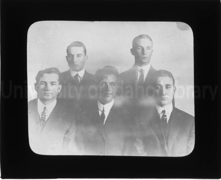 Portrait of five unidentified men.