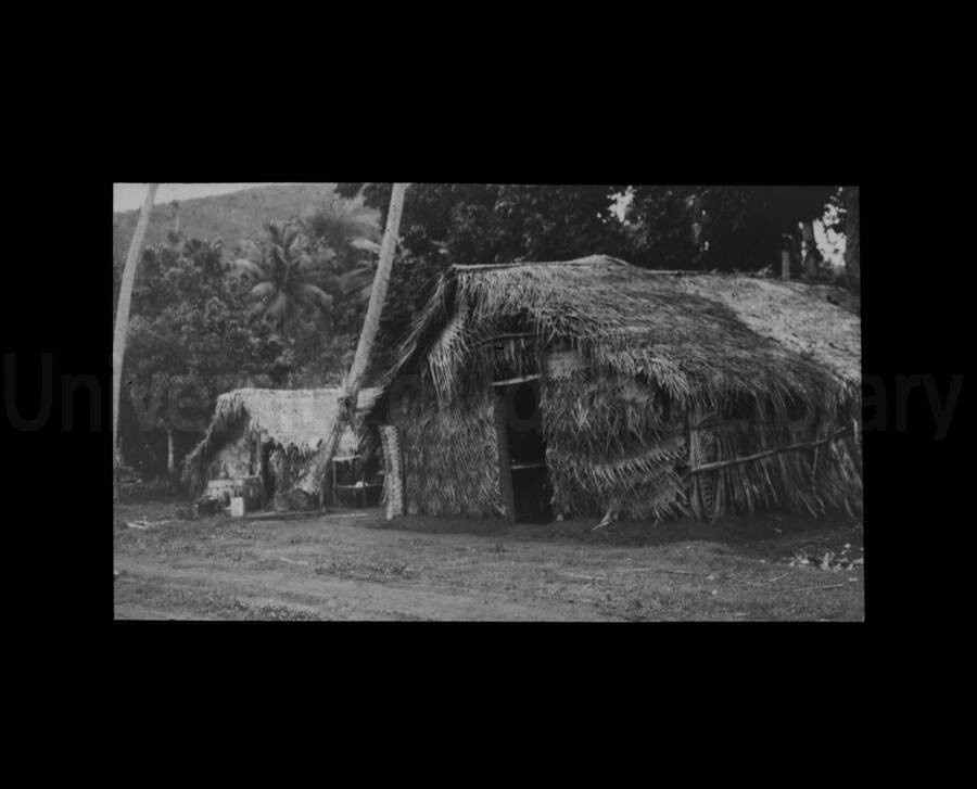Straw houses, huts in an unknown location.