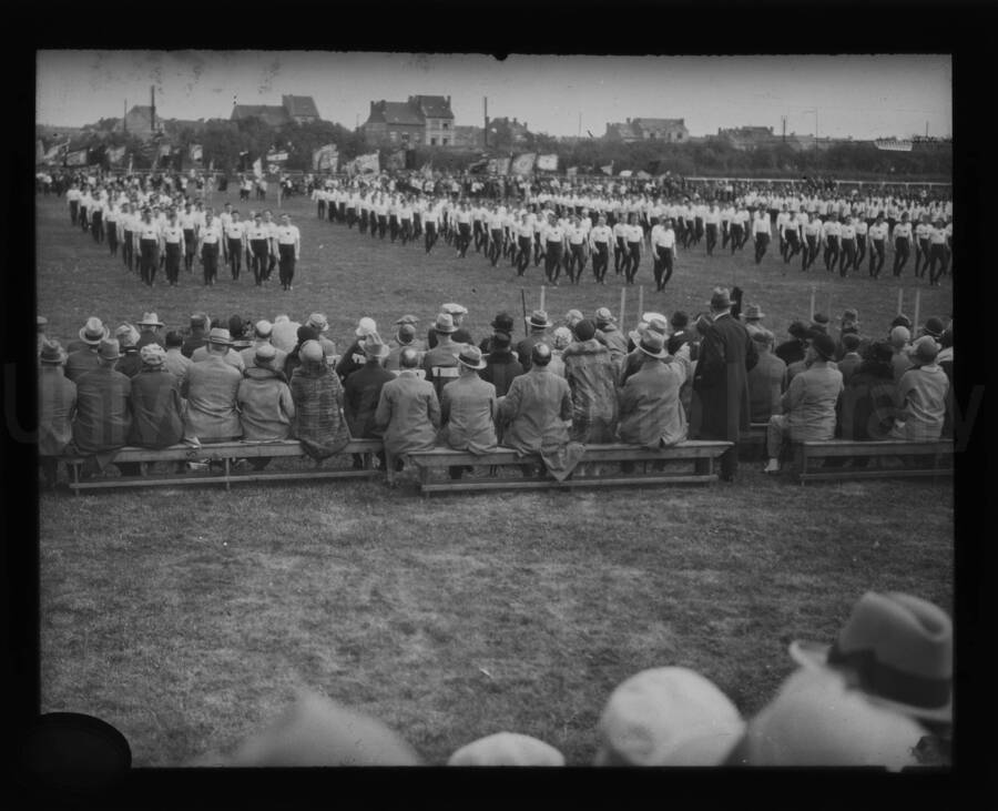 Men on parade in an open field.