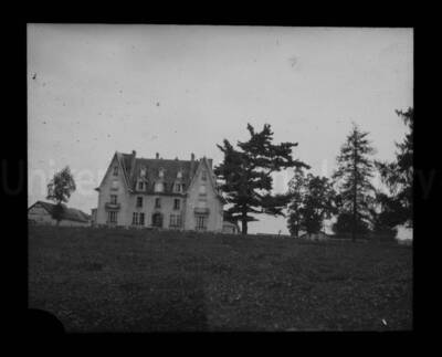 A building in the distance on the crest of a hill.