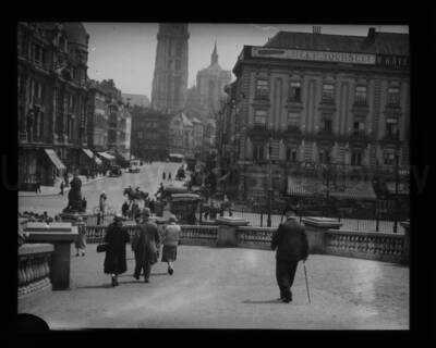 A street scene in front of a hotel in an unknown location.