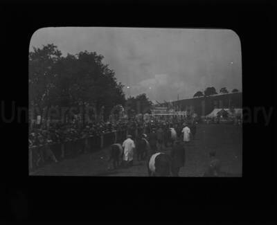 Participants walking beasts to showing grounds at an exhibition at the University of Idaho.