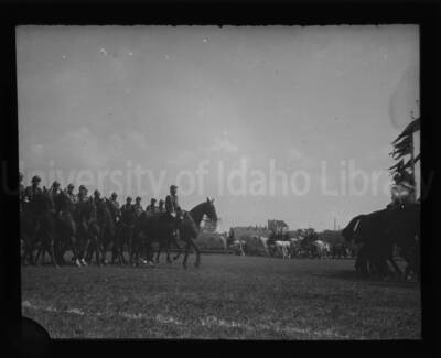 Cavalry parade in an open field near the University of Idaho.