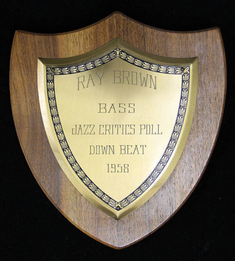 Ray Brown Bass Jazz Critics Poll Down Beat, 1958.  7 1/2 x6 1/2 inch shield wood finish plaque with engraved plate.