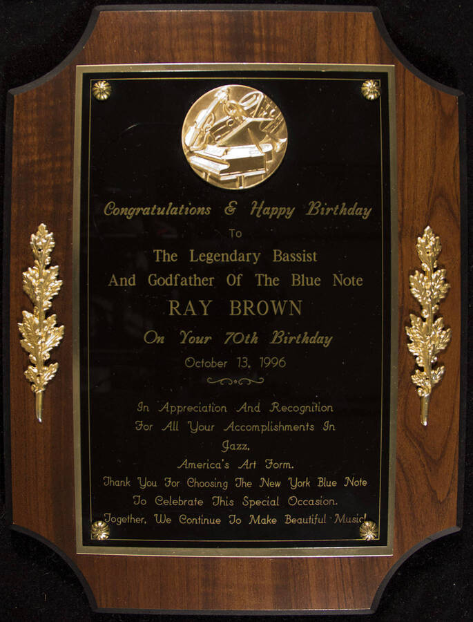 Congratulations and Happy Birthday to the legendary bassist and godfather of The Blue Note Ray Brown on your 70th birthday, October 13, 1996.  12 x 9 inch wood finish plaque with engraved plate.