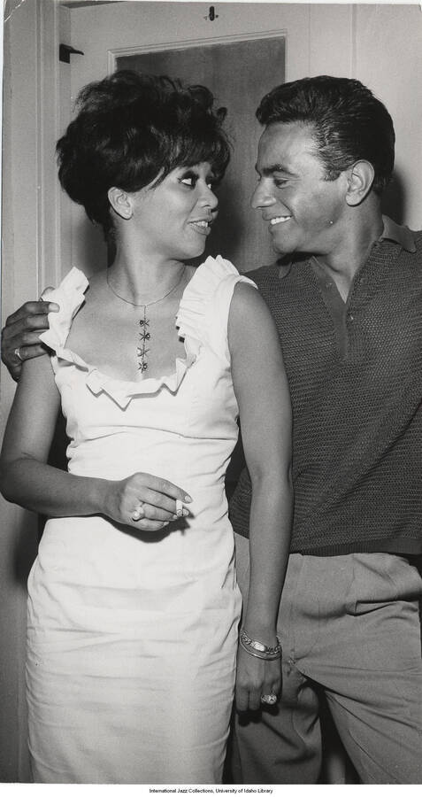 10 x 5 1/2 inch photograph; Johnny Mathis and an unidentified woman