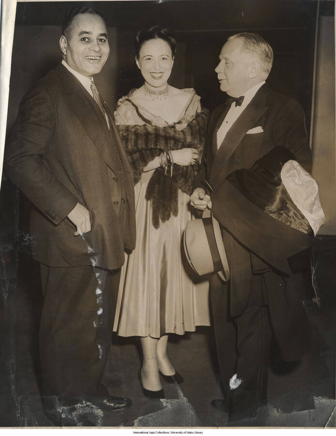 10 x 8 inch photograph; unidentified men and woman