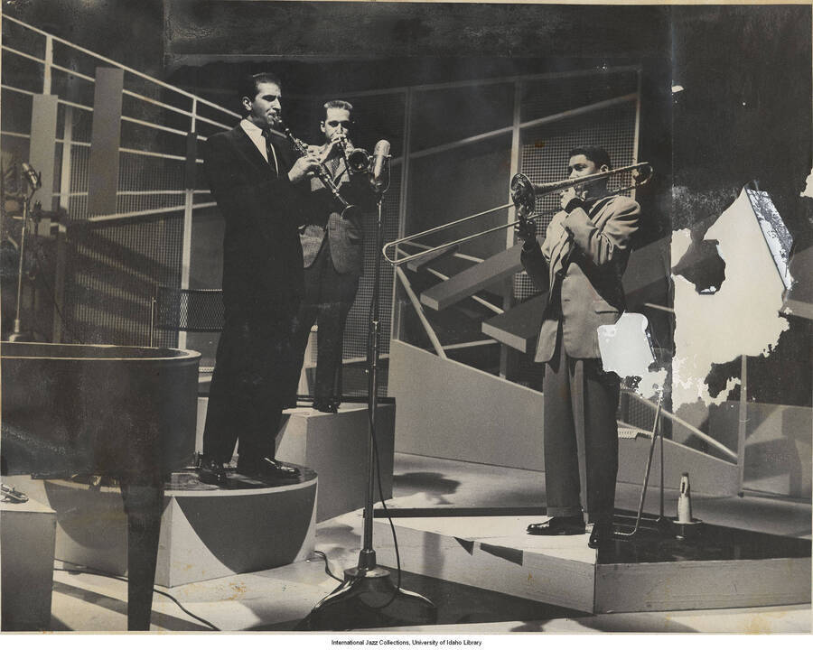 7 x 9 inch photograph; Tony Scott clarinetist, with unidentified trumpeter, and trombonist