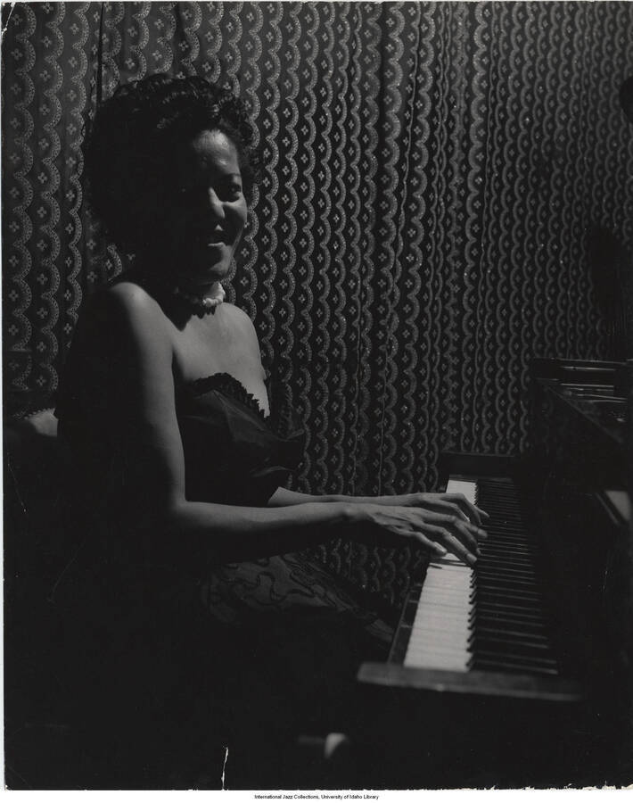 10 x 8 inch photograph; Beryl Booker playing the piano