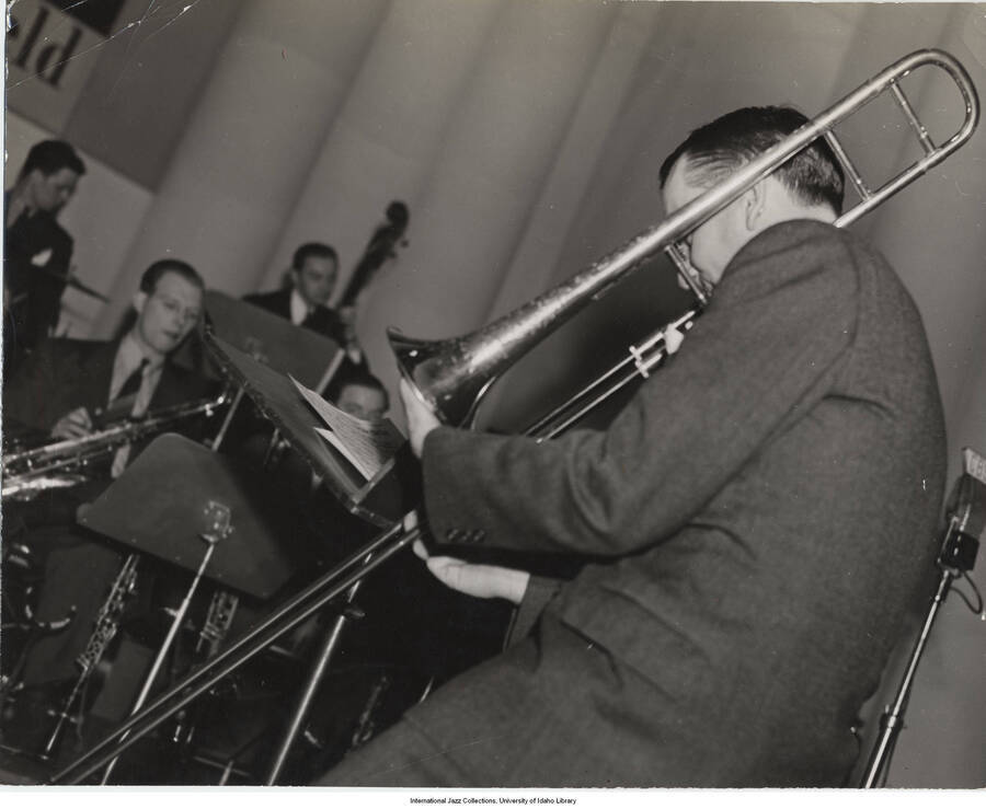 7 1/2 x 9 1/2 inch photograph; unidentified trombonist at CBS studio. Stamped on the back of the photograph: George B. Evans, NY