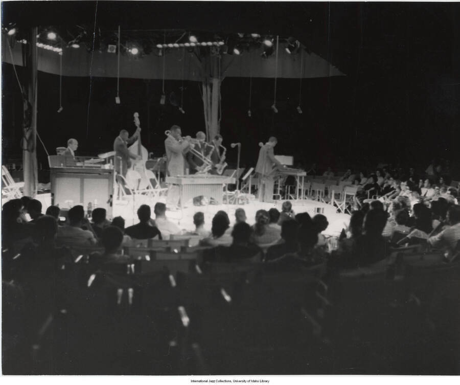 7 1/2 x 9 1/4 inch photograph; unidentified band and audience. Handwritten on the back of the photograph: Norma York