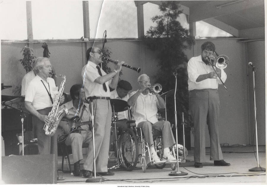5 x 7 inch photograph; Eddie Miller on tenor sax, unknown guitarist, Chuck  Hedges on clarinet, Johnny Best on trumpet, and Don Ingle on valve trombone (1 duplicate)