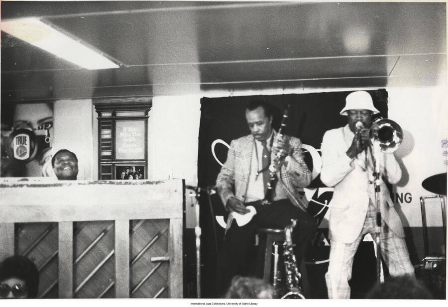 8 1/2 x 11 inch photograph; Buddy Tate and Al Grey on Staten Island Ferry jazz Boatride. (This photo is stuck together with photo LHIV 0440 due to moisture)