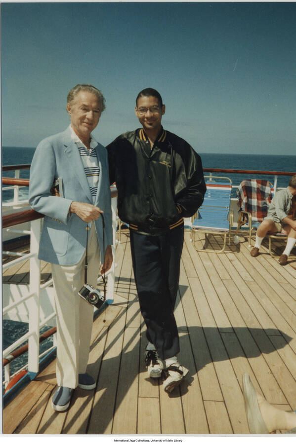 5 x 3 1/2 inch photograph; Leonard Feather and Brandford Marsalis on board a cruise ship