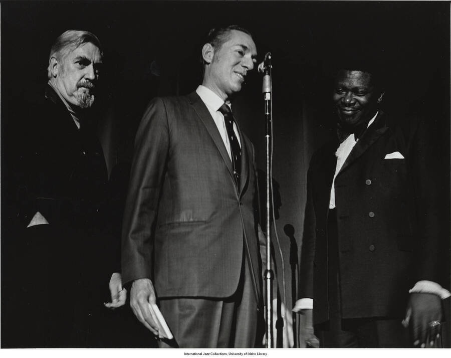 7 x 9 inch photograph; Leonard Feather and two unidentified men [at the Las Vegas Convention Center]