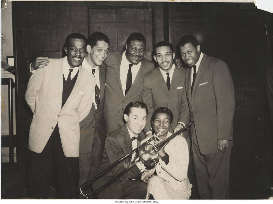 8 x 10 inch photograph; Trombonists' convention at Birdland: Matthew Gee, Trummy Young, Henry Coker, Benny Powell, Al Gray, Leonard Feather, and Melba Liston. This photograph is published in Leonard Feather's book The Jazz Years: Earwitness to an era