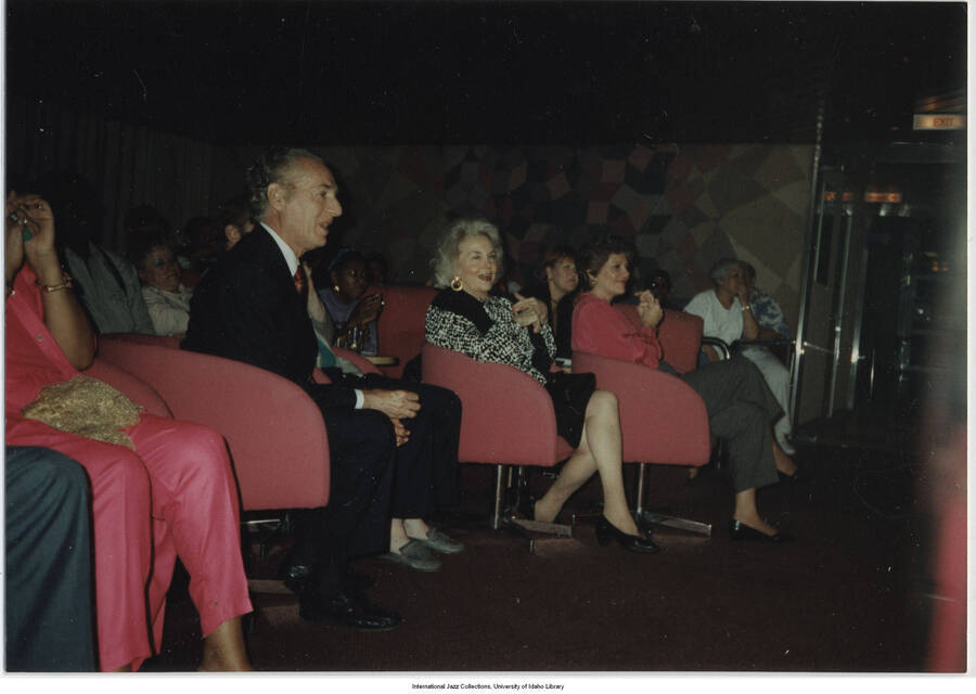 3 1/2 x 5 inch photograph; Jane and Leonard Feather in an auditorium
