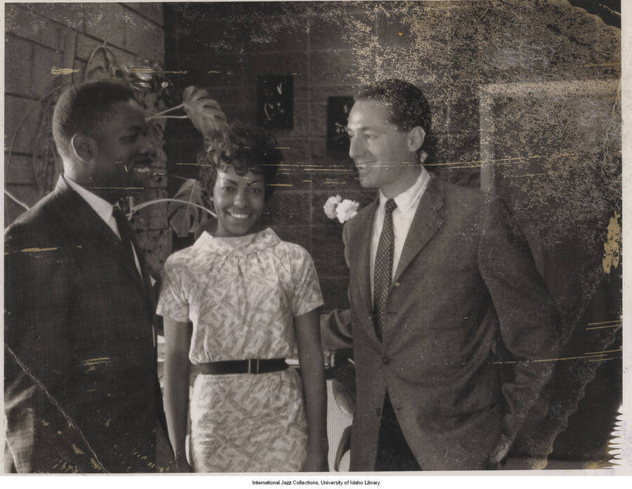 3 1/4 x 4 1/4 inch photograph; Leonard Feather with unidentified man and woman