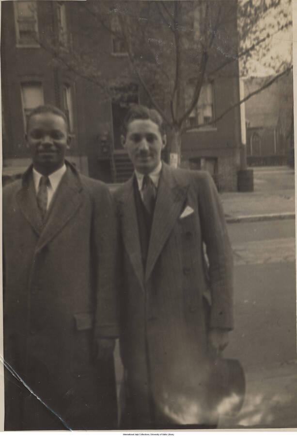 7 x 5 inch photograph; Leonard Feather with an unidentified man on the street