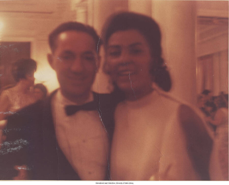 8 x 10 inch photograph; Leonard Feather with an unidentified woman