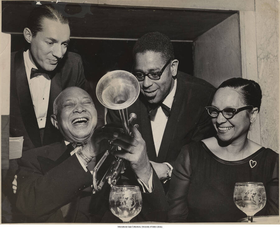 8 x 10 inch photograph; Leonard Feather, W.C. Handy, Dizzy Gillespie, and Mrs. Handy. Label on the back of the photograph reads: Publicato 1987-09-08
