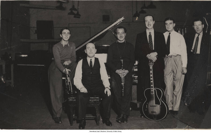 3 1/2 x 5 1/2/ inch photograph in post card format; Ye Olde English Swynge Band. Danny Polo on clarinet, Tommy  McQuarteron cornet, Eddie Freeman on guitar, and  Eddie Macauley on bass