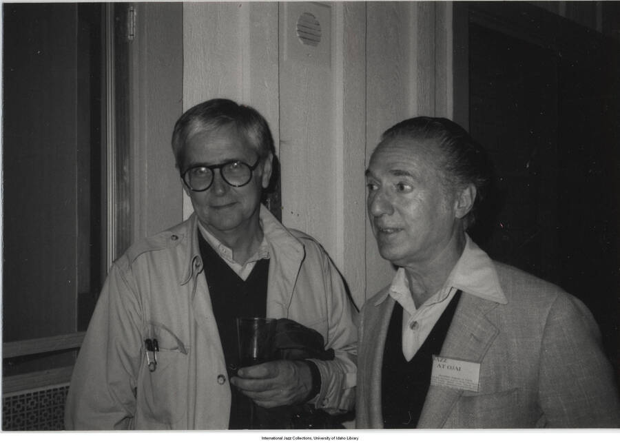 3 1/2 x 5 inch photograph; Leonard Feather with a name tag that reads: Jazz at Ojai, with an unidentified man
