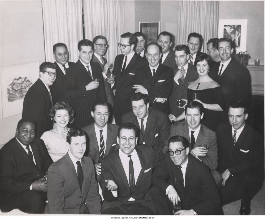 8 x 10 inch photograph; Leonard Feather with unidentified persons