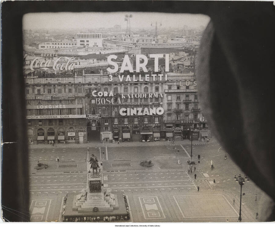 7 3/4 x 9 3/4 inch photograph; view of a square from above, surrounded by buildings and an equestrian monument at the center of the square [in Italy]