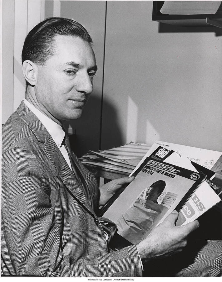 10 x 8 inch photograph. Leonard Feather holding some LPs, seen on top is the Quincy's Got a Brand New Bag