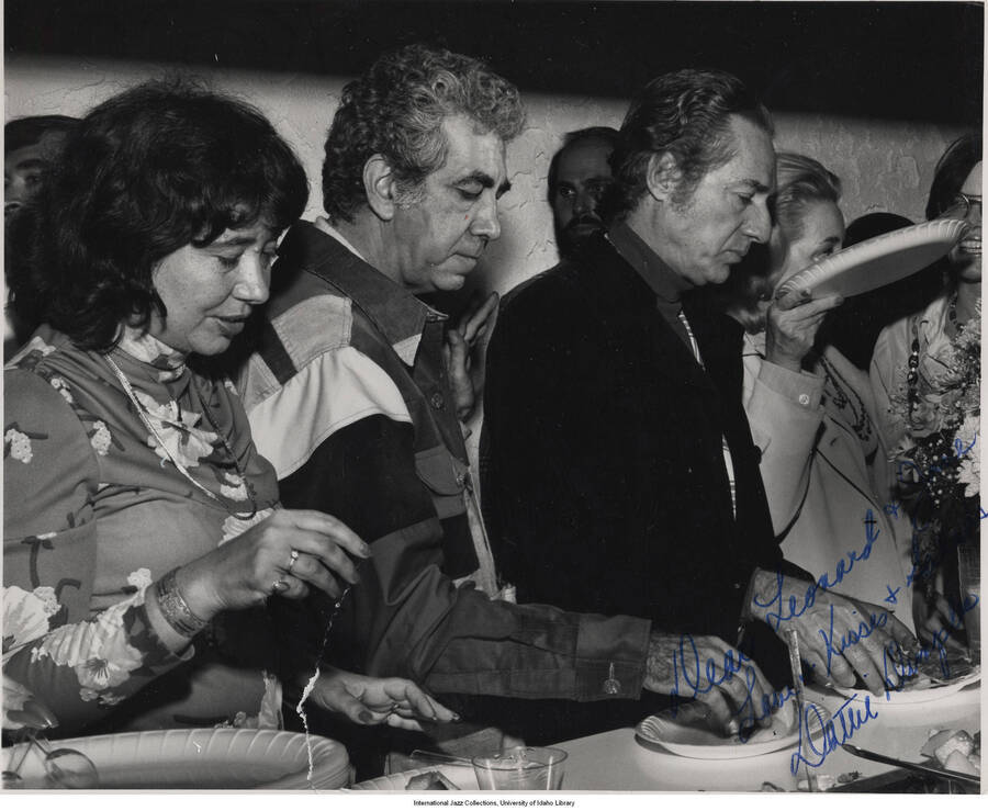 10 x 8 inch signed photograph; Leonard Feather and unidentified persons in a banquet. The photograph is dedicated to Jane and Leonard Feather