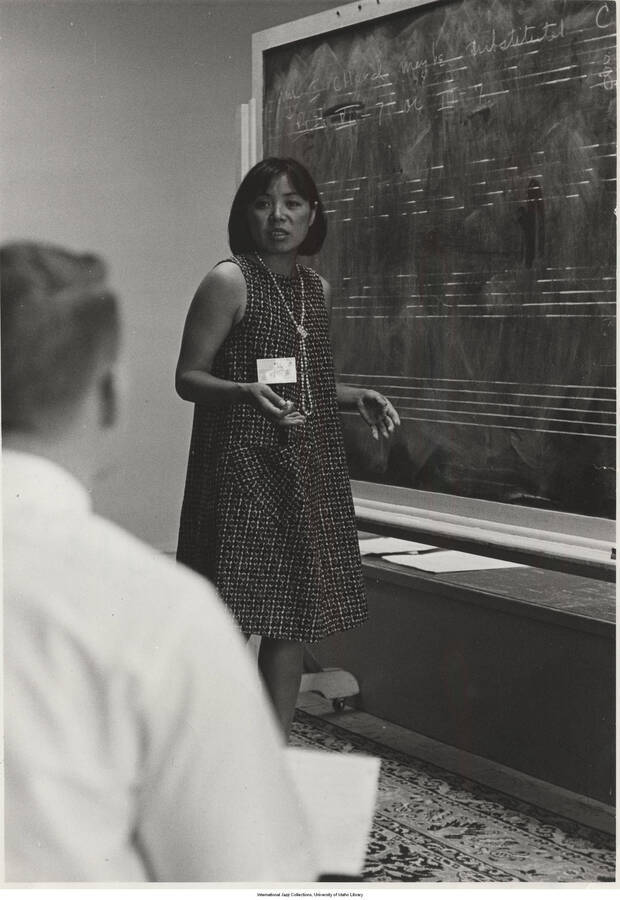 7 x 5 inch photograph; Toshiko Akiyoshi. Typewritten on the back of the photograph: Toshiko Akiyoshi at Summer Jazz Clinic, University of Utah, Salt Lake City, 1965