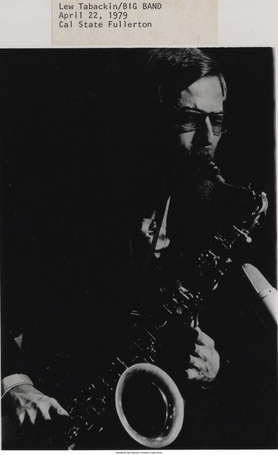 8 1/8 x 5 inch photograph; Akiyoshi-Tabackin Big Band. Label on the front of the photograph reads: Akiyoshi-Tabackin Big Band. 1979-04-22. Cal State Fullerton