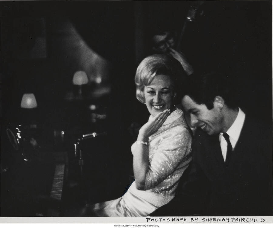 8 x 10 inch photograph; Marian McPartland, Jim Kappes, and Jack Gregg. Handwritten on the back of the photograph: Marian McPartland, piano; Jim Kappes, drums; Jack Gregg, bass. Taken at the apartment, 1966-12