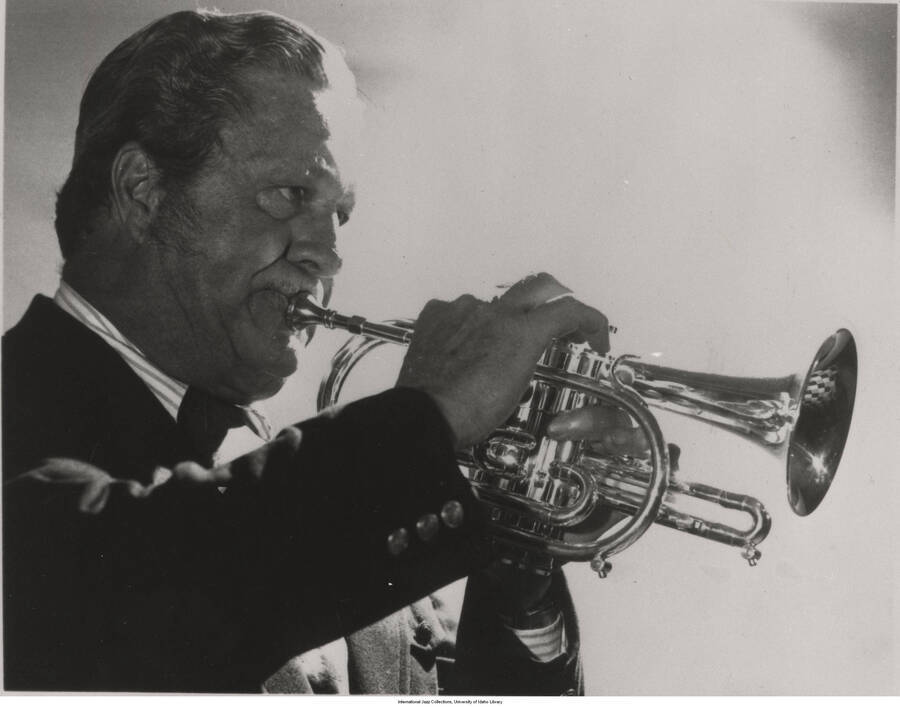 8 x 10 inch photograph; Jimmy McPartland playing the trumpet. This photograph is published in Leonard Feather's and Ira Gitler's book The Encyclopedia of Jazz in the Seventies
