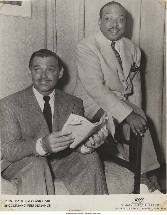 10 x 8 inch photograph; Count Basie and Clark Gable. Handwritten on the back of the photograph: The 2 kings. King of Swing. King of Movies; Return to Count Basie 174-27 Adelaide Lane, St. Albans, N.Y.
