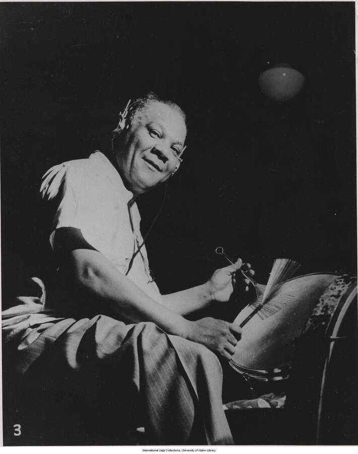10 x 8 inch photograph; Sidney Bechet playing the drums