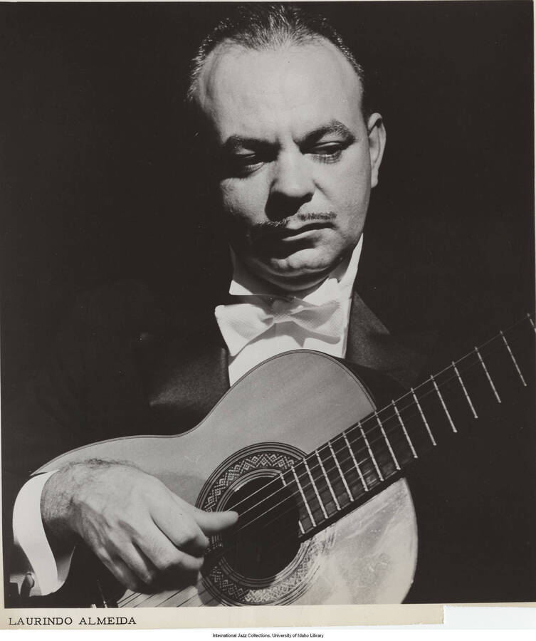 9 x 8 inch photograph; Laurindo Almeida playing the guitar