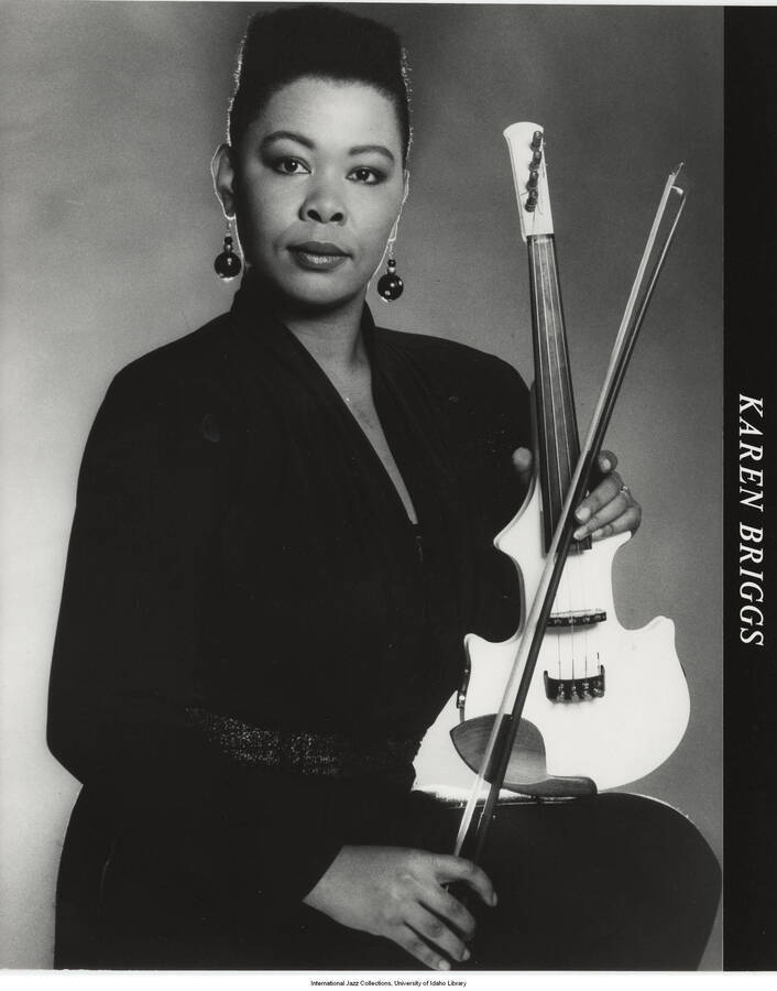 10 x 8 inch photograph; Karen Briggs posing with her violin