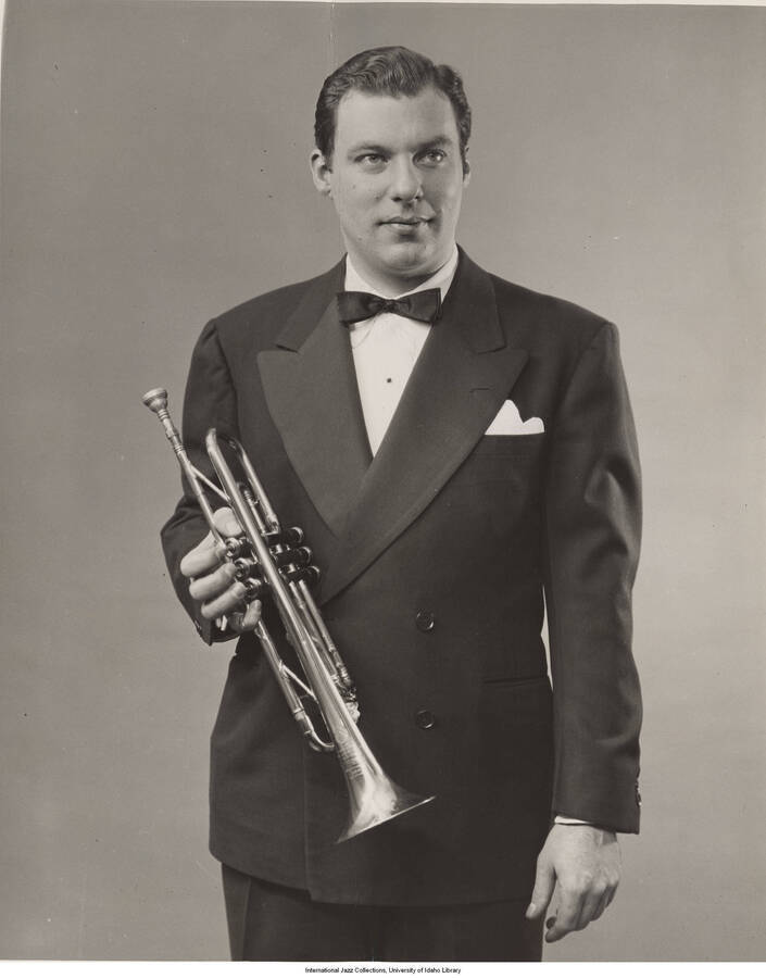 10 x 8 inch photograph; Bobby Burnet posing with his trumpet