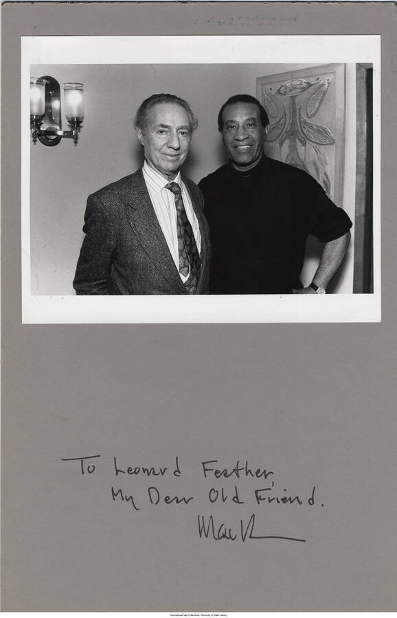 8 x 10 inch signed photograph; Leonard Feather and drummer Max Roach. The photograph is glued to a 17 x 11 inch cardboard. The cardboard includes a dedication to Leonard Feather from [MacK…?]