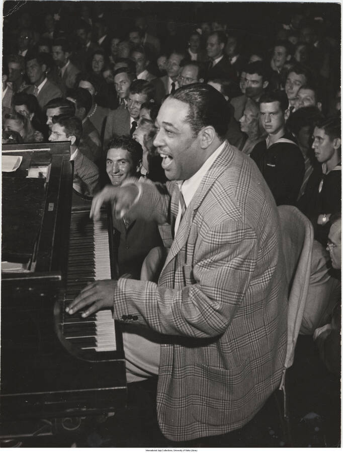 13 5/8 x 10 3/8 inch photograph; Duke Ellington playing the piano